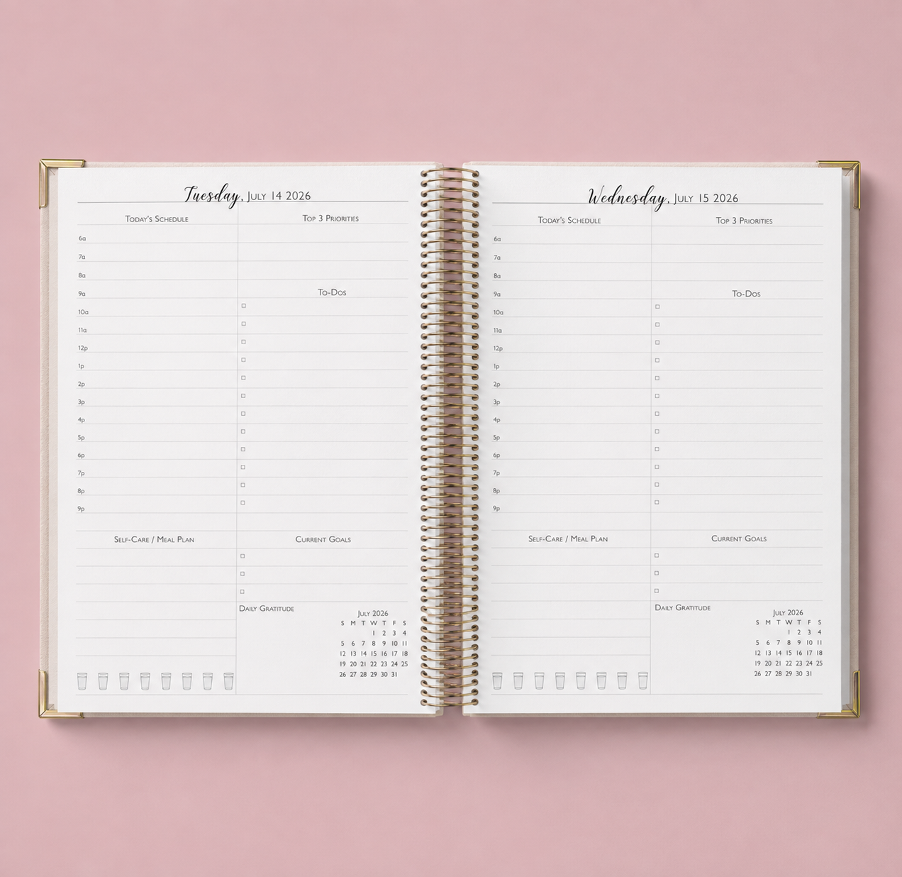 An open spiral-bound daily planner pages with gold-toned binding.